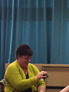 Image of Martin demonstrating daily living aids to group at Warwick University