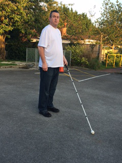 Image of Martin walking with cane