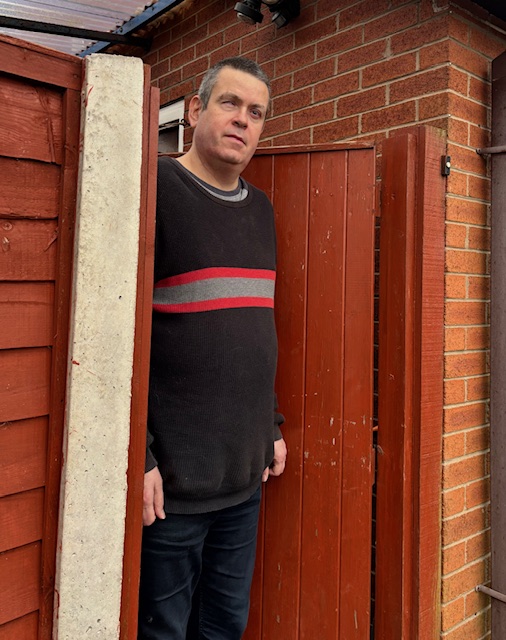 Photo of Martin Rigby stood at open gate