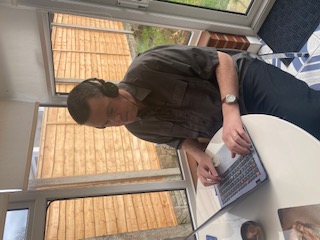 Photo of Martin using his laptop